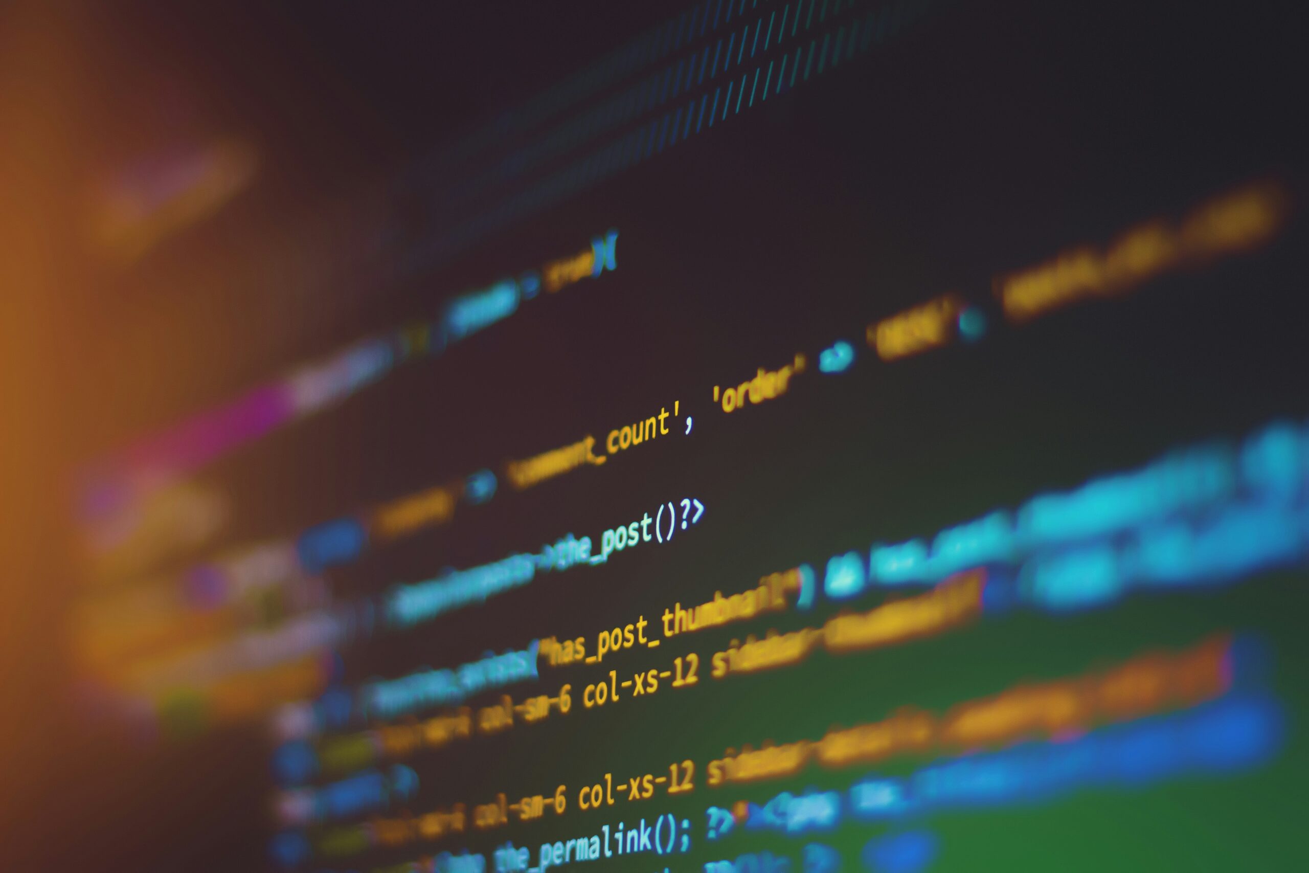 Close-up of colourful programming code on a screen